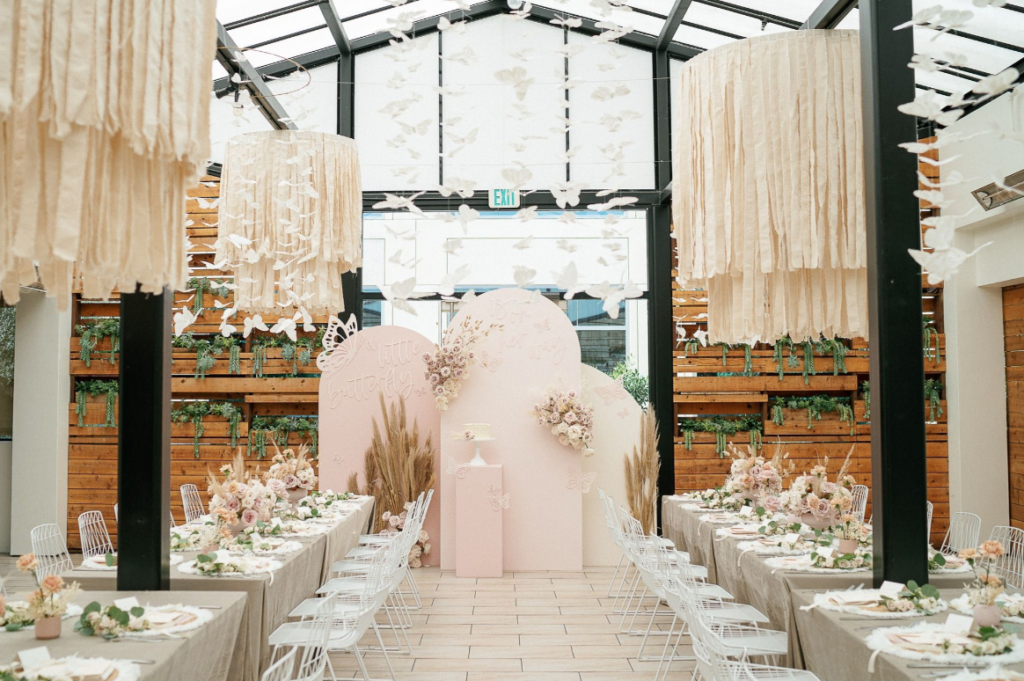 Beautiful semi-indoor greenhouse style with rustic wood backdrops and off white accents. Perfect for engagement ceremonies or weddings.